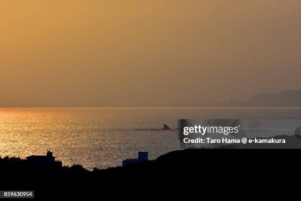 eboshi rock islands in chigasaki beach in chigasaki city in kanagawa prefecture in japan in the sunset - chigasaki beach stock pictures, royalty-free photos & images