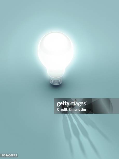 group of people touched by the light from a bulb - long shadow shadow stock pictures, royalty-free photos & images