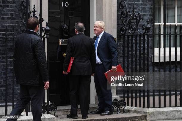 Foreign Secretary Boris Johnson looks towards journalists as he arrives in Downing Street ahead of a Cabinet meeting on October 10, 2017 in London,...