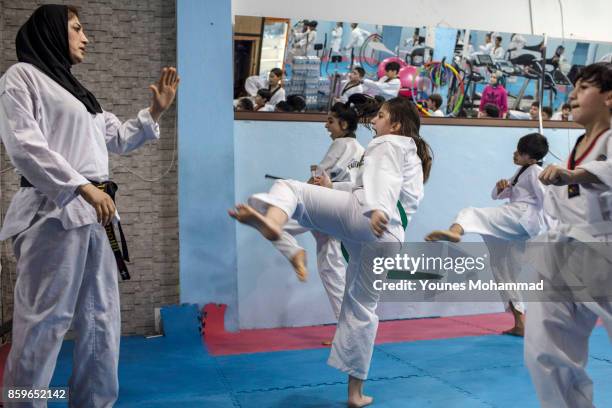 Members of the Malek Taekwondo Centre take part in classes in Erbil, Iraq on August 30, 2017. The Centre, one of many in Erbil, is owned and run by a...