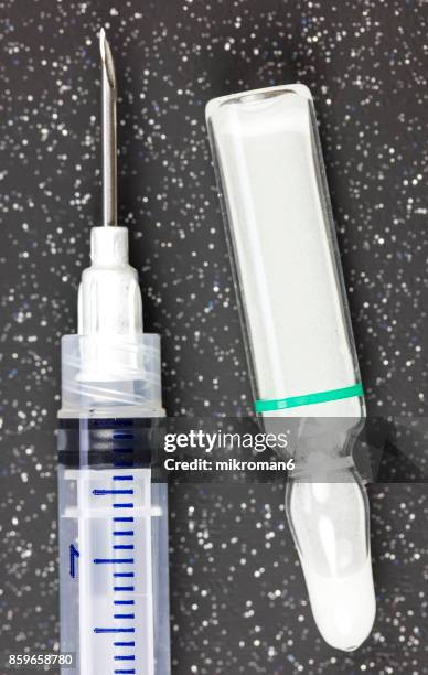 medical syringe and drug ampule. medical concept - cruet stock pictures, royalty-free photos & images