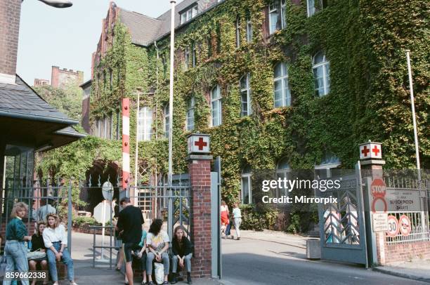 People wait outside Red Cross centre in East Berlin, Germany 22nd September 1989, As with many organisations, the centre is suffering from a shortage...