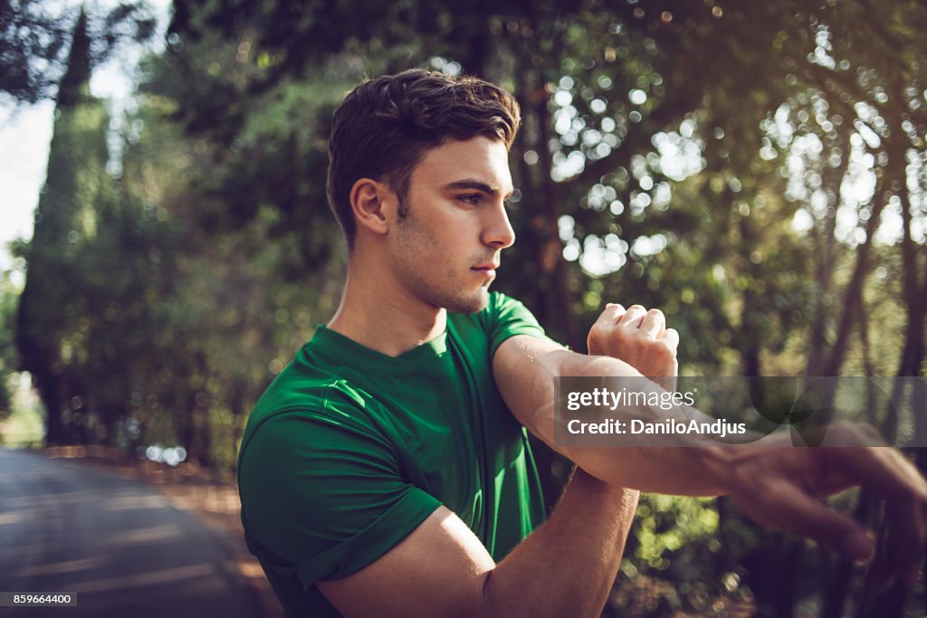 Young man exercising in nature