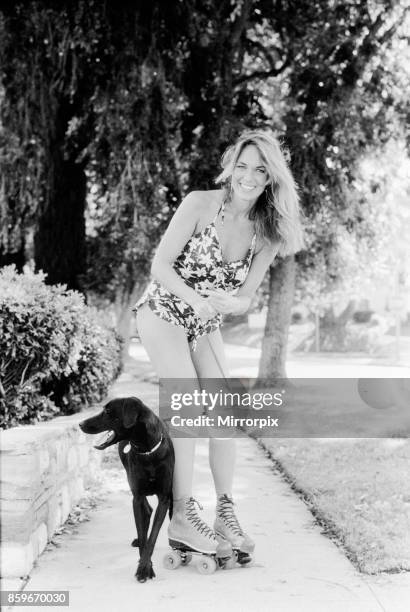 Catherine Bach actress who stars as Daisy Duke in tv series The Dukes of Hazard; pictured at home in Los Angeles California May 1982, Catherine is...