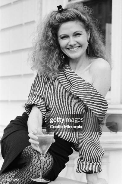 Owner of the Pineapple Dance Studios Debbie Moore celebrates after being named 'The Veuve Clicquot' Businesswoman of the Year, 12th March 1984.