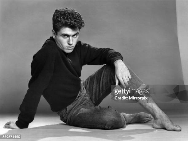 George Michael of the teenage duo Wham!, poses in the studio, 30th October 1982.