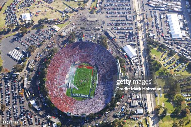 95th Rose Bowl: Aerial view of US Air Force B-2 Stealth Bomber during flyover as USC Trojans Marching Band perform national anthem before game vs...