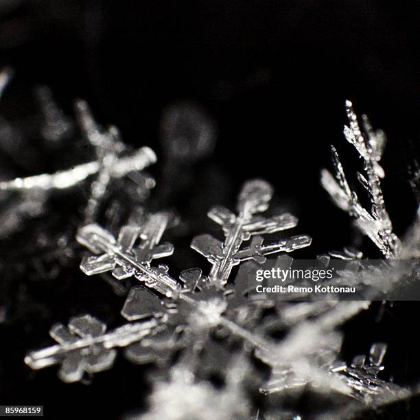 snowflake - christianity black background stock pictures, royalty-free photos & images