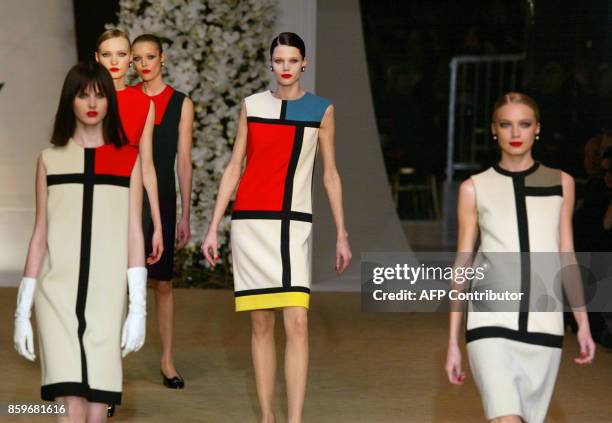 Models present dresses by French designer Yves saint-Laurent, inspired in 1965 by the work of Dutch painter Piet Mondrian 22 January 2002, during...