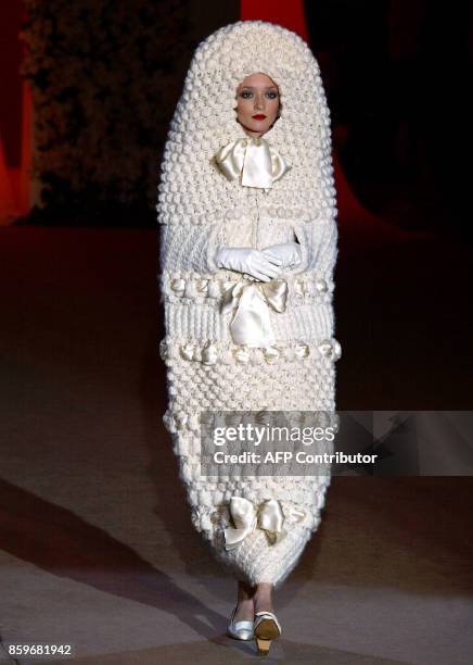 Model presents a creation for French designer Yves Saint Laurent, 22 January 2002, during the retrospective part of Saint Laurent's last ever show at...