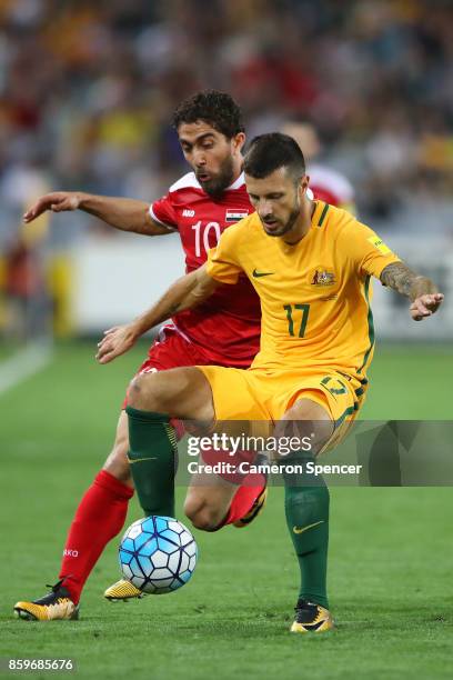 Nikita Rukavytsya of Australia and Firas Alkhatib of Syria contest the ball during the 2018 FIFA World Cup Asian Playoff match between the Australian...
