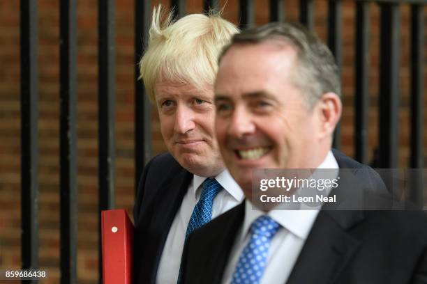 Foreign Secretary Boris Johnson and International Trade Secretary Liam Fox leave Downing Street following a Cabinet meeting on October 10, 2017 in...