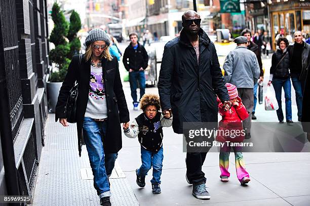 Television personality Heidi Klum, son Henry Samuel, singer Seal, and daughter Leni Klum walk in Soho on April 13, 2009 in New York City.