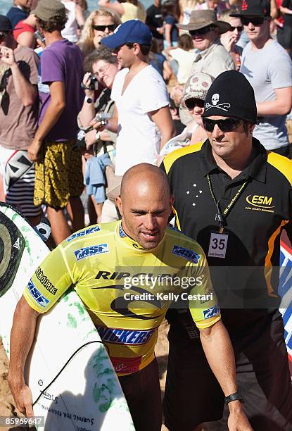 Nine time ASP World Champion Kelly Slater of the United States is escorted through the crowd by security after losing his Round 2 heat of the Rip...