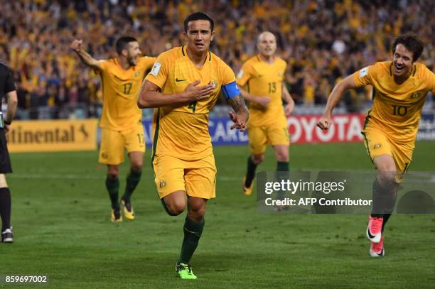 Tim Cahill of Australia celebrates with teammates after scoring against Syria during their 2018 World Cup football qualifying match against Syria...