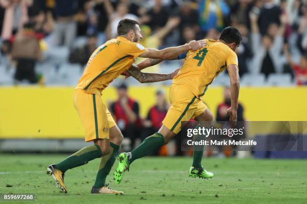 Tim Cahill of Australia celebrates scoring a goal with team mate Nikita Rukavytsya of Australia during the 2018 FIFA World Cup Asian Playoff match...