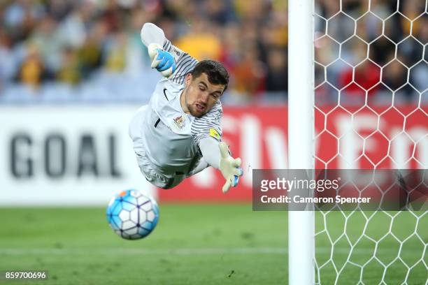 Mathew Ryan of Australia saves a goal during the 2018 FIFA World Cup Asian Playoff match between the Australian Socceroos and Syria at ANZ Stadium on...