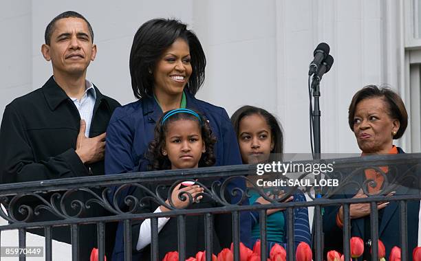 President Barack Obama stands alongside First Lady Michelle Obama, their daughters Sasha and Malia and Marian Robinson , Michelle's mother, for the...