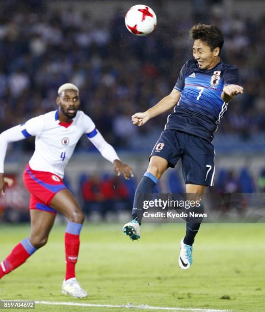 Japan midfielder Shu Kurata heads the opening goal during the first half of an international friendly against Haiti at Nissan Stadium in Yokohama,...