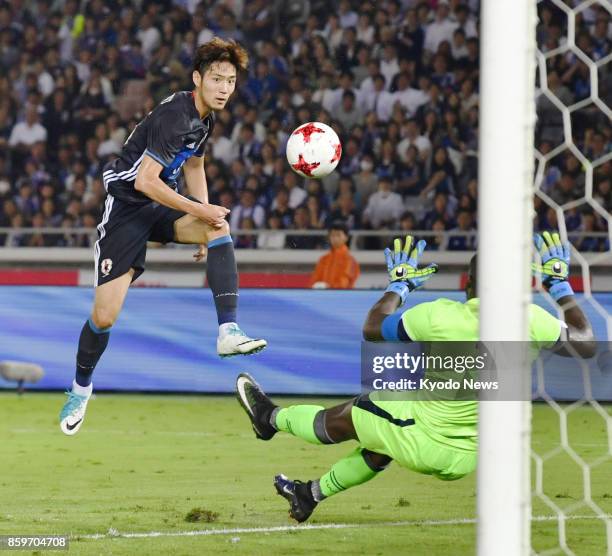 Japan forward Kenya Sugimoto scores his side's second goal during the first half of an international friendly against Haiti at Nissan Stadium in...