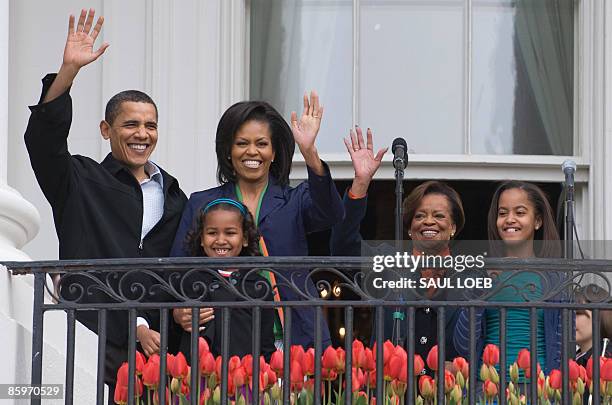 President Barack Obama waves alongside First Lady Michelle Obama, their daughters Sasha and Malia and Marian Robinson , Michelle's mother, during the...