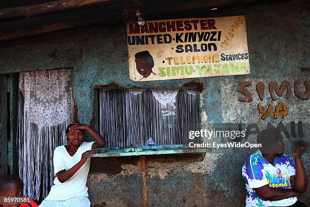 Hairdresser salon, called Manchester United, with telefone service Nairobis Kibera Slum on March 20, 2009 in Nairobi, Kenya. The Kibera Slum is home...