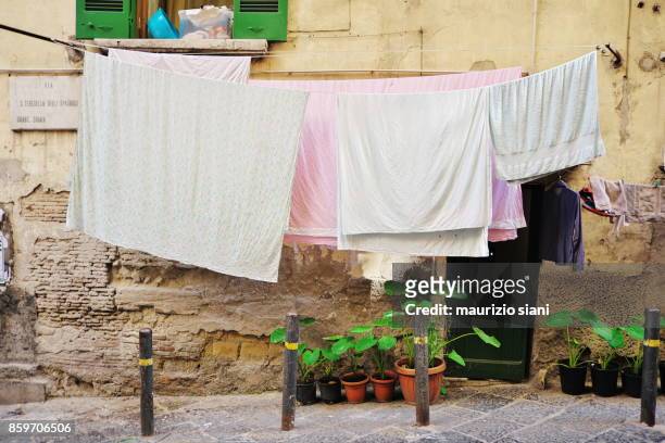 laundry along street - drying stock pictures, royalty-free photos & images