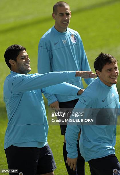 Porto's Brazilian player Givanilno 'Hulk' Souza and Argentinians Tomas Costa and Cristian Rodriguez joke before the team training session at the...