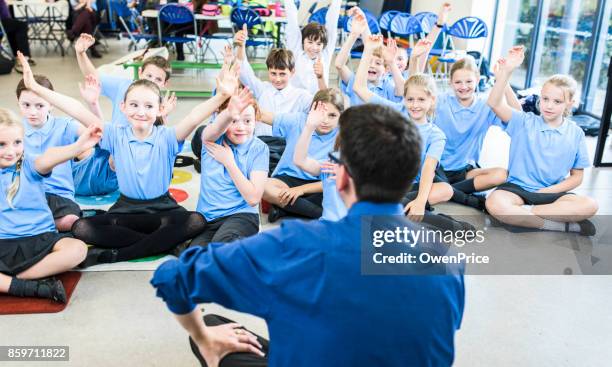 education uk primary school assembly - elementary school stock pictures, royalty-free photos & images