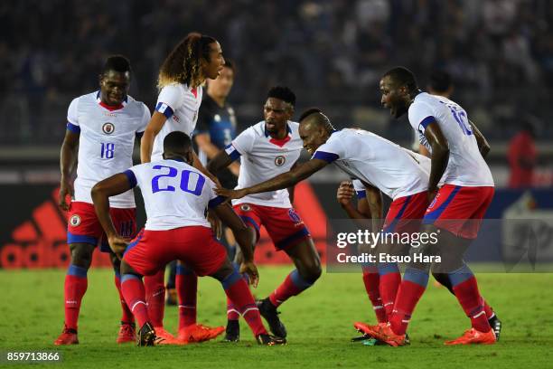 Duckens Nazon of Haiti celebrates scoring his side's third goal with his team mates during the international friendly match between Japan and Haiti...