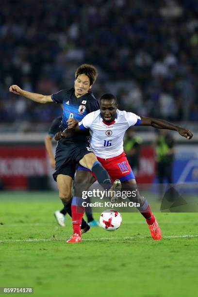 Andrew Anderson Jean-Baptiste of Haiti and Genki Haraguchi of Japan compete for the ball during the international friendly match between Japan and...