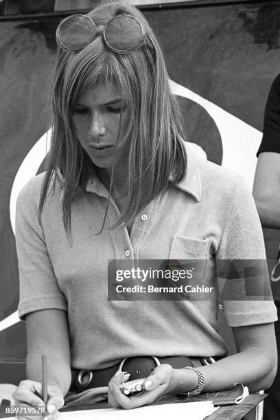 Helen Stewart, Grand Prix of Great Britain, Silverstone Circuit, July 19, 1969. Helen Stewart doing the timing in the Tyrrell box, British Grand Prix...