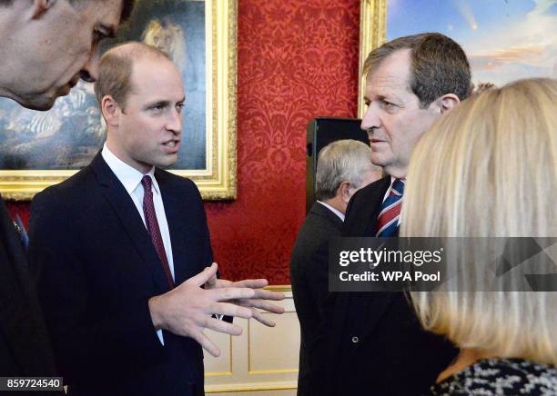 Prince William, Duke of Cambridge speaks to Alastair Campbell at a reception on World Mental Health Day to celebrate the impact of the Heads Together...