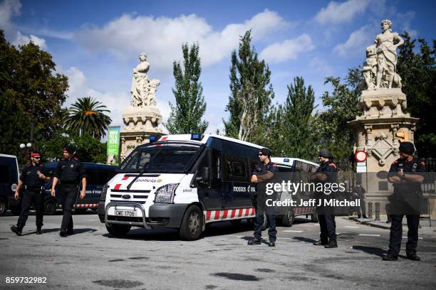 The Spanish Mossos D' Esquadra stand guard at the entrance to the Parliament of Catalonia on October 10, 2017 in Barcelona, Spain. After the October...