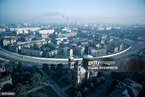 An aerial view of divided Berlin, looking over Saint Thomas Church in the western part of the city, across the Berlin Wall to the east, 1981.