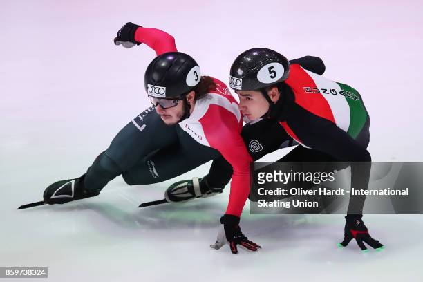 Samuel Girard of Canada and Sahong Liu of Hungary compete in the Mens 500m semi finals race during the Audi ISU World Cup Short Track Speed Skating...
