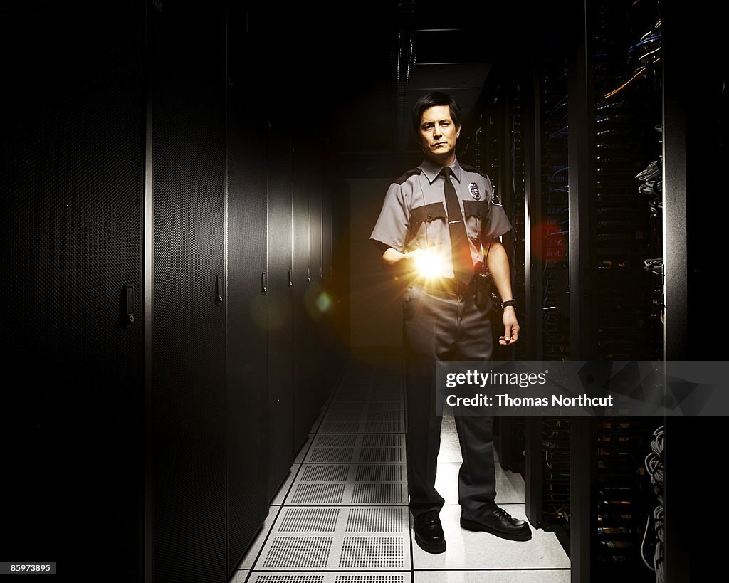 Security officer inside of server room.
