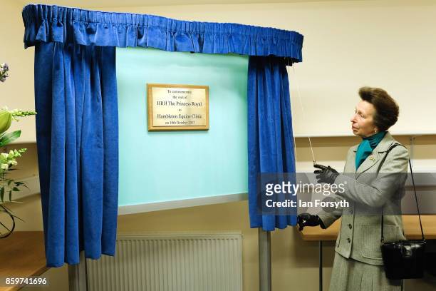 Princess Anne, Princess Royal, unveils a plaque as she visits the Hambleton Equine Clinic on October 10, 2017 in Stokesley, England. The facility is...