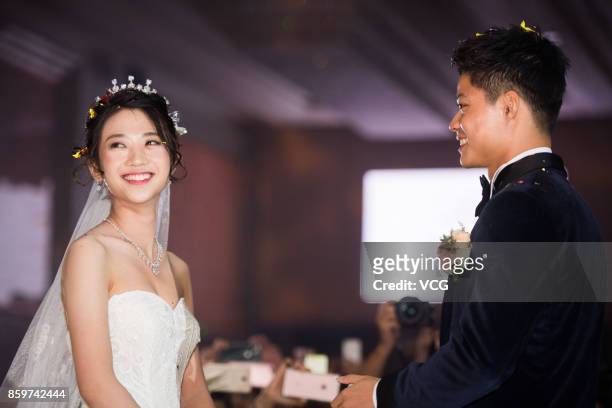 Chinese sprinter Su Bingtian and wife Lin Yanfang hold their wedding ceremony on October 10, 2017 in Zhongshan, Guangdong Province of China.