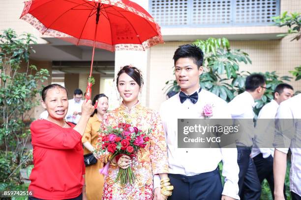 Chinese sprinter Su Bingtian and wife Lin Yanfang hold their wedding ceremony on October 10, 2017 in Zhongshan, Guangdong Province of China.