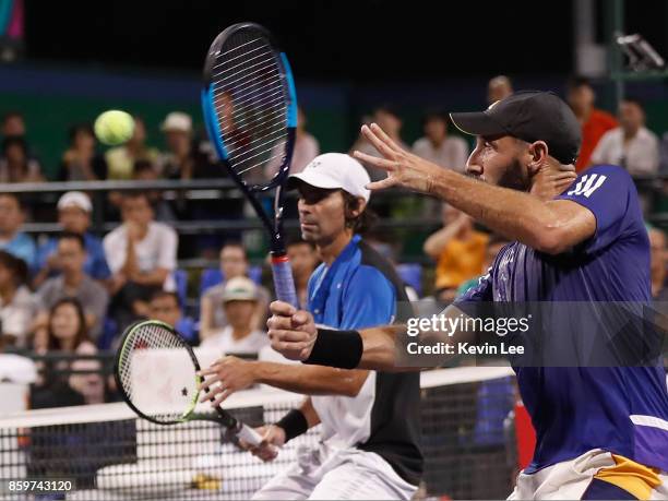 Santiago Gonzalez of Mexico and Julio Peralta of Chile in action against Paolo Lorenzi of Italy and Albert Ramos-Vinolas of Spain during Men's Double...