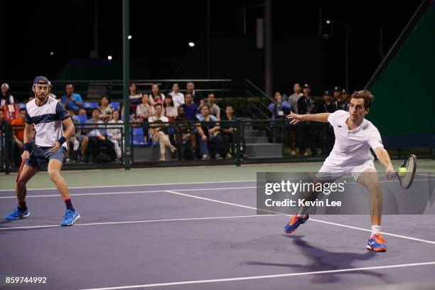 Paolo Lorenzi of Italy and Albert Ramos-Vinolas of Spain in action against Santiago Gonzalez of Mexico and Julio Peralta of Chile during Men's Double...