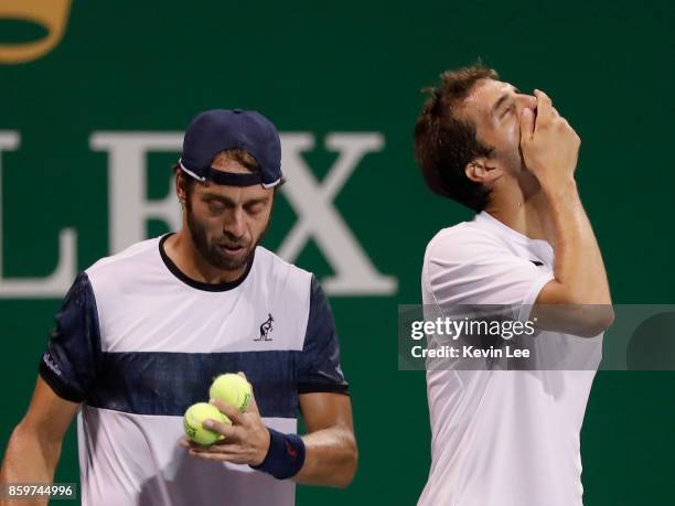 Paolo Lorenzi of Italy and Albert Ramos-Vinolas of Spain in action against Santiago Gonzalez of Mexico and Julio Peralta of Chile during Men's Double...