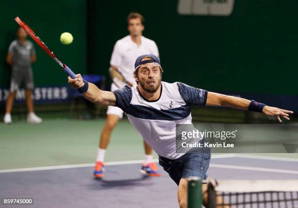 Paolo Lorenzi of Italy and Albert Ramos-Vinolas of Spain in action against Santiago Gonzalez of Mexico and Julio Peralta of Chile during Men's Double...
