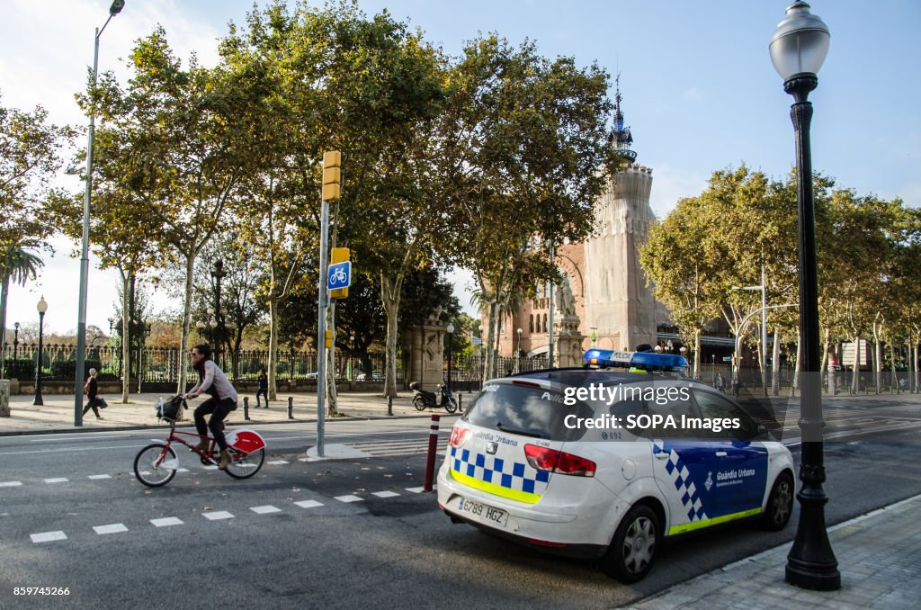 A police car control the access to the Ciutadella park and...