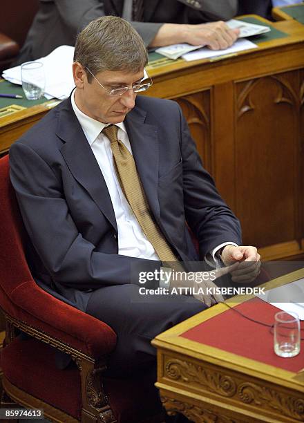Hungarian Prime Minister Ferenc Gyurcsany sits in the main hall of the parliament building as former Minister of Economy and Transport, the Prime...