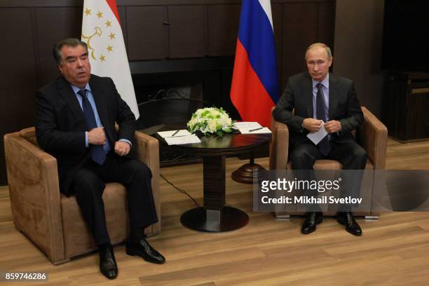 Russian President Vladimir Putin greets Tajik President Emomali Rakhmon during their meeting on October 11, 2017 in Sochi, Russia. Leaders of...