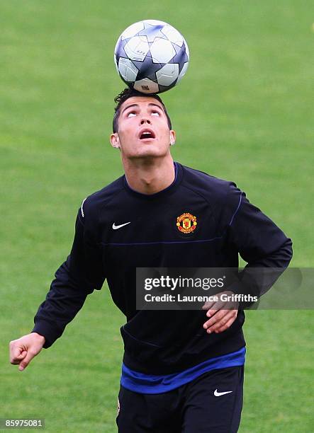 Cristiano Ronaldo balances the ball on his head during the Manchester United Training Session prior to their UEFA Champions League Quarter Final...