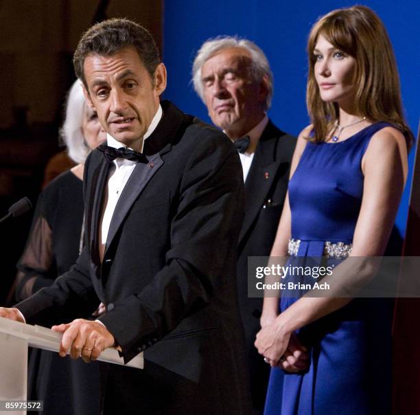 President of France Nicolas Sarkozy, author and humanitarian Elie Wiesel, and first lady of France Carla Bruni-Sarkozy at the Elie Wiesel Foundation...