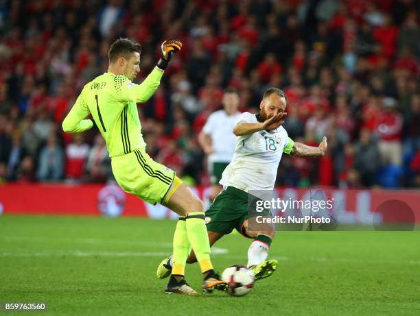 Wayne Hennessey of Wales gets tackled by David Meyler of Republic of Ireland during FIFA World Cup group qualifier match between Wales and Republic...